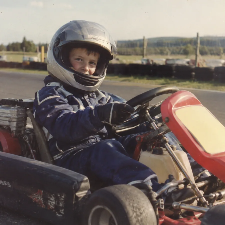 Kai as a child in a go-kart